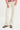 Person wearing white jeans on a white background