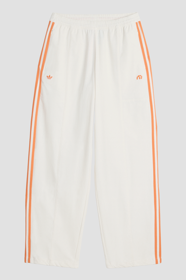 white adidas trackpant with orange stripes