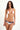 Woman wearing a white bikini with red and blue accents on a white background