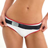 Woman wearing a white bikini with red accents on a white background