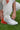 silver and orange adidas shoe with white sole and tongue zipper