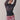 sheet navy sweater with ribbed waist and mini skirt with red-and-white hawaiian print