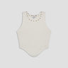 white cotton tank top with scoop hem and dome studs on neckline