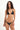Woman wearing a black bikini with star-like embellishments on a white background