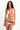 Woman wearing a white bikini with red accents on a white background