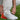 silver and orange adidas shoe with white sole and tongue zipper